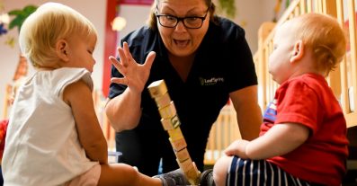 Teacher Playing with Blocks with Infants