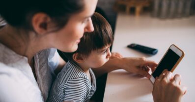 Child and mother using cellphone